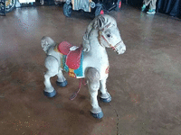 Image 1 of 2 of a N/A ROLLING HORSE BLUE ON THE SADDLE