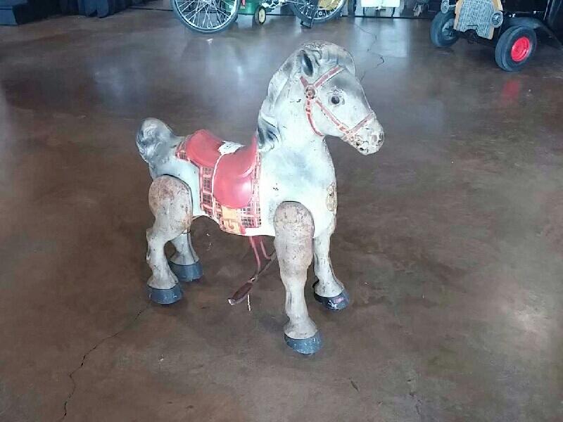 0th Image of a N/A ROLLING HORSE SADDLE IS RED AND YELLOW