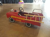 Image 3 of 3 of a N/A FIREFIGHTER PEDAL CAR BLACK SEAT AND BELL