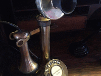 Image 1 of 2 of a 1910 CANDLESTICK ROTARY PHONE