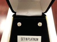 Image 1 of 1 of a N/A PLATINUM SOLITAIRE EARRINGS