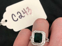 Image 1 of 2 of a N/A EMERALD AND DIAMOND PLATINUM RING