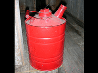Image 1 of 1 of a N/A RED GASOLINE CAN WITH SPOUT AND LID