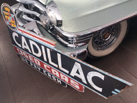 Image 2 of 2 of a N/A CADILLAC USED CAR SIGN