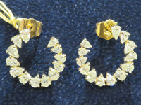 Image 2 of 3 of a N/A GOLD PEAR& OVAL DIAMOND EARRINGS