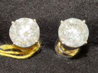 Image 1 of 3 of a N/A 18K GOLD DIAMOND STUD EARRINGS