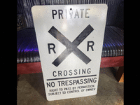Image 1 of 2 of a N/A RAILROAD CROSSING PRIVATE, NO TRESPASSING