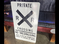 Image 2 of 2 of a N/A RAILROAD CROSSING PRIVATE, NO TRESPASSING