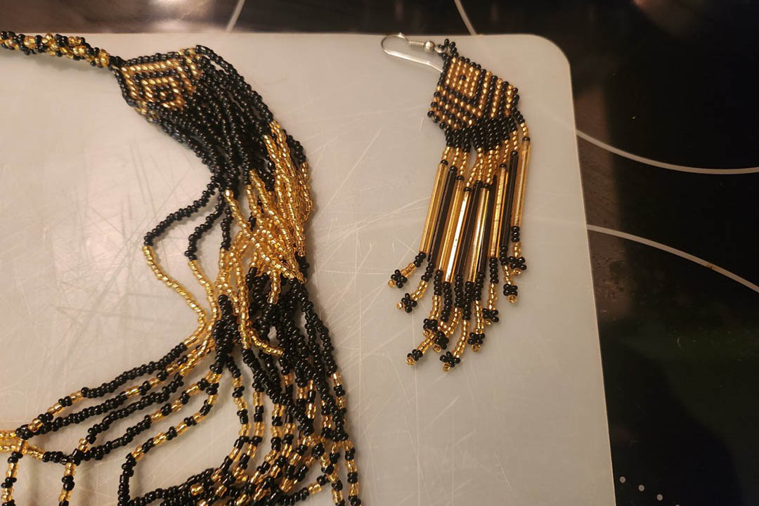 1st Image of a N/A BEADED BLK & GLD NECKLACE & EARRINGS