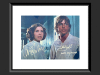 Image 1 of 1 of a N/A STAR WARS CARRIE FISHER AND MARK HAMILL SIGNED PH