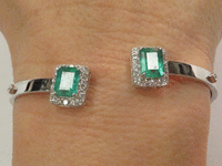 Image 3 of 4 of a N/A 18K GOLD EMERALD DIAMOND BANGLE