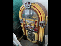 Image 1 of 1 of a N/A ANTIQUE JUKEBOX WITH MATCHING SPEAKERS
