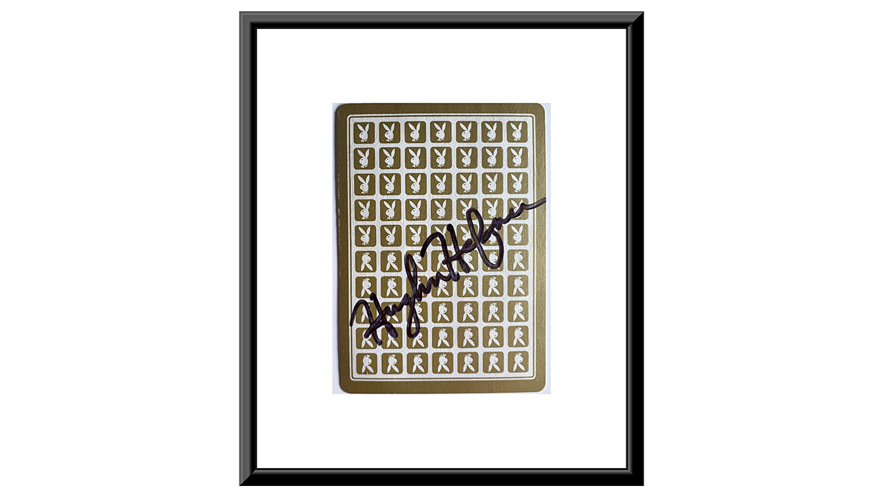 0th Image of a N/A HUGH HEFNER SIGNED PLAYING CARD. GFA AUTHENTICATED