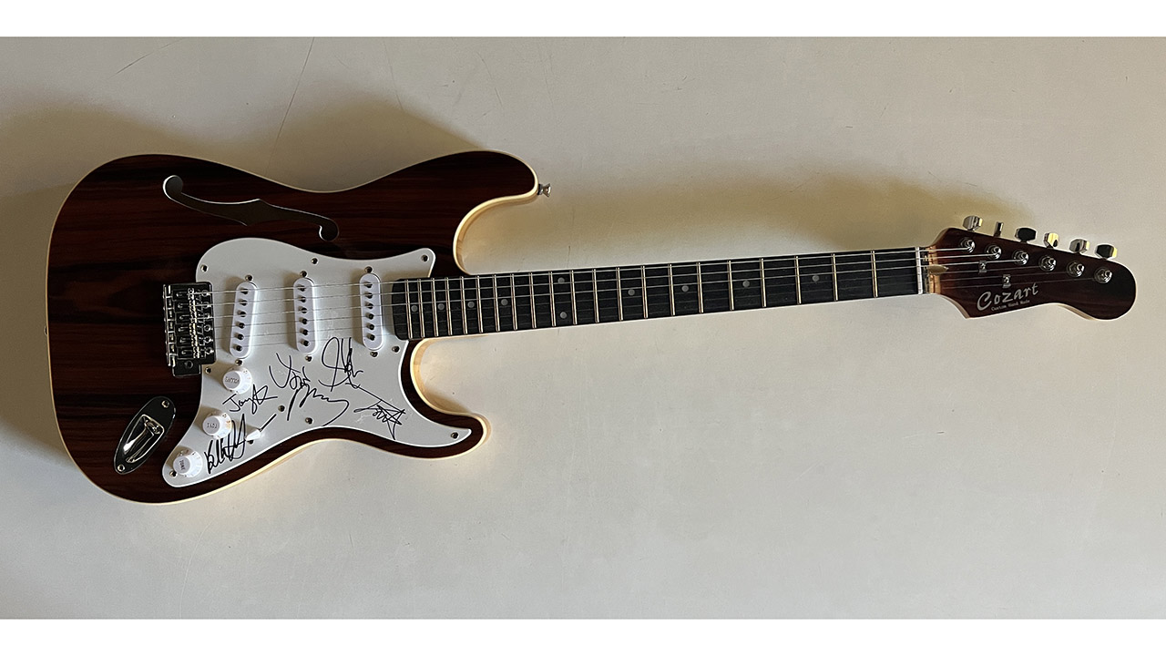 0th Image of a N/A AEROSMITH BAND SIGNED WOOD GRAIN GUITAR