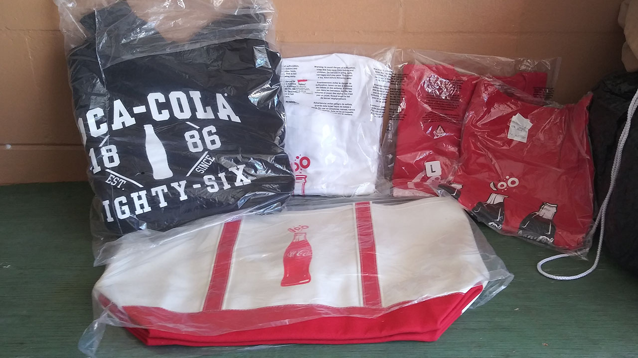 0th Image of a N/A LOT OF NEW IN WRAPPER COCA COLA T-SHIRTS, HOODIES AND BAGS