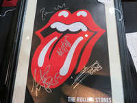 Image 1 of 1 of a N/A ROLLING STONES BAND SIGNED MINI POSTER