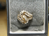 Image 1 of 2 of a N/A GOLD AND DIAMOND CLUSTER RING