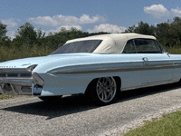Image 3 of 20 of a 1961 OLDSMOBILE STARFIRE